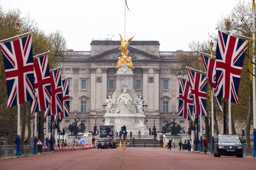 Buckingham Palace lined up with Union Jack flags