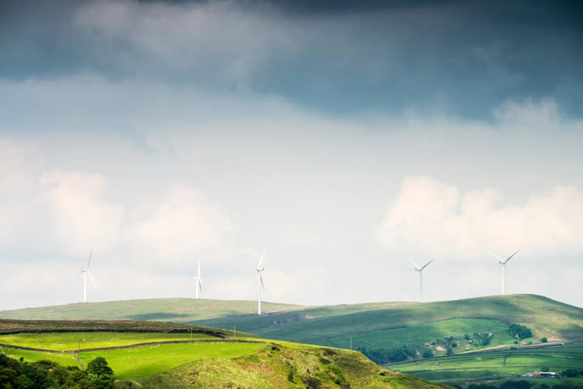 Windmills during cloudy day