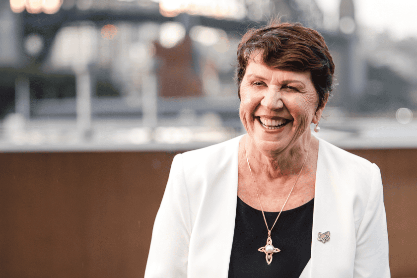cheryl-mallett Cheryl Mallett, standing outdoors withthe Sydney Harbour Bridge in the background, smiles