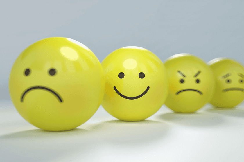 Yellow balls displaying different emotions including sad, happy and angry