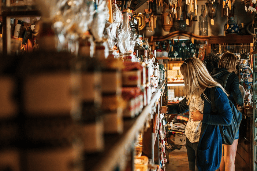 households-income-inflation-girl-4181395_1280 A woman browses wares in a souvenir shop