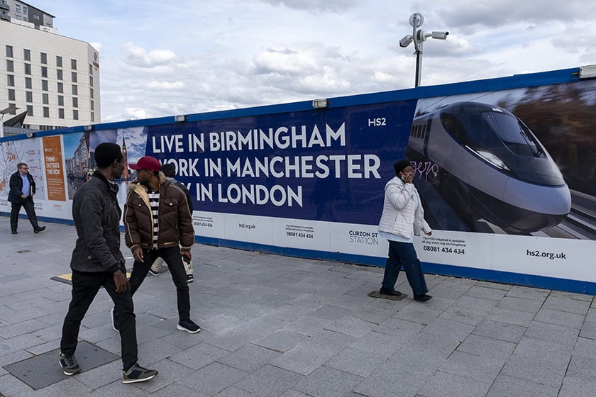HS2 Construction Site In Birmingham Promotional hoarding for HS2 carries the slogan 'live in Birmingham, work in Manchester, play in London'.