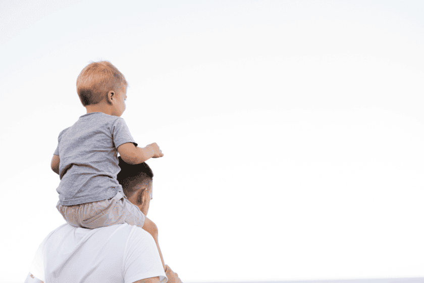 Father carrying his son on his shoulders