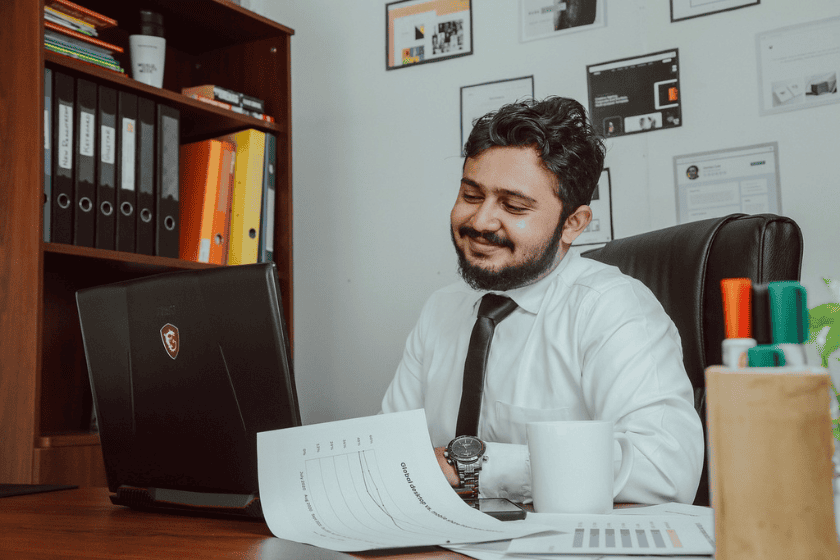 An office worker looks at his laptop