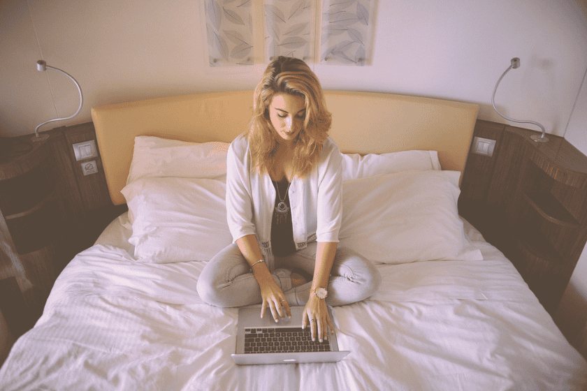 A woman on her laptop in bed