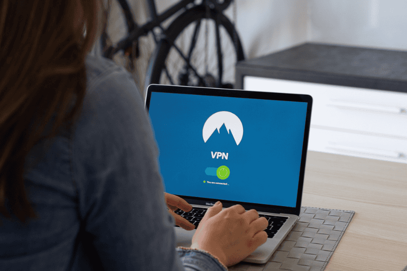 A person accesses a VPN on a laptop