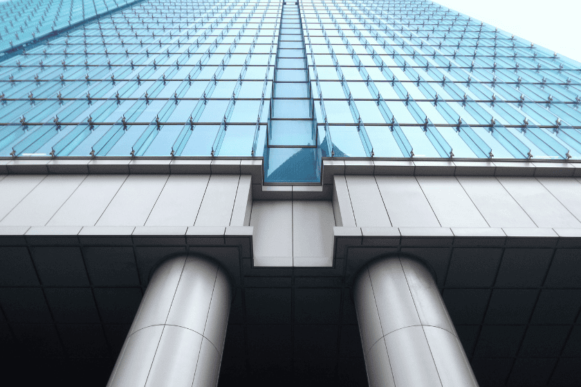 The exterior facade of a glass office building