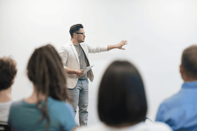 public-speaking A man presenting to an audience